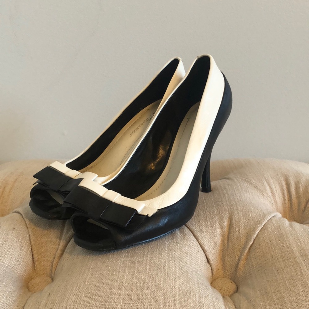 Black and white peep toe pumps with bows